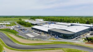 Home 2 Aerial view of the Lotus Cars Limited site at Hethel, Norfolk, showing the Chapman Production Centre and test track