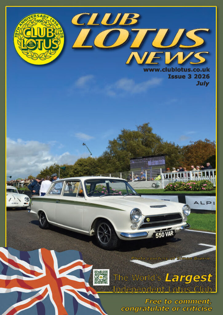 White Lotus Cortina Mk1 with green side flash, registration 550 VAR, parked at a race circuit